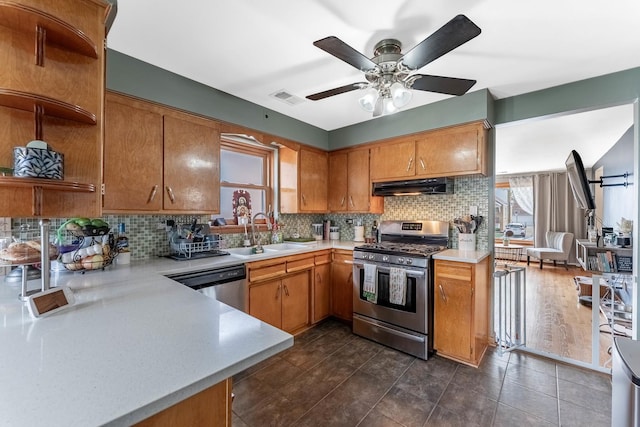 5626 S Nashville Ave, Chicago, IL 60638 - kitchen with light countertops, open shelves, under cabinet range hood, appliances with stainless steel finishes, and a sink