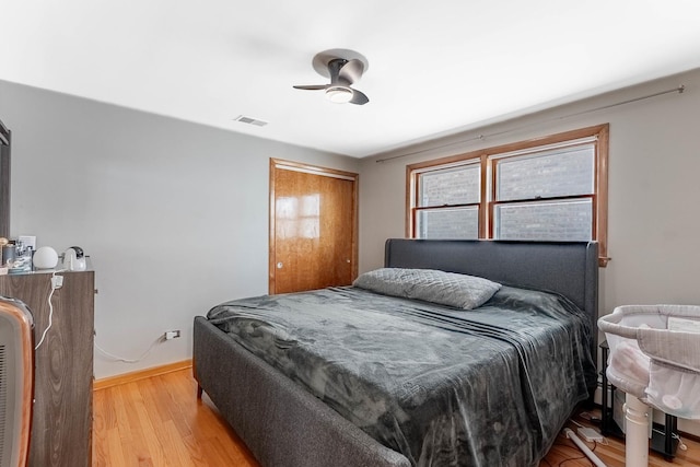 5626 S Nashville Ave, Chicago, IL 60638 - bedroom with light wood-type flooring, a closet, baseboards, and visible vents