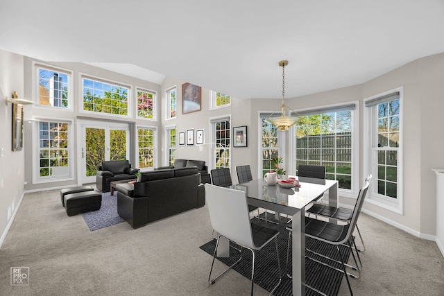 dining area with carpet flooring and baseboards