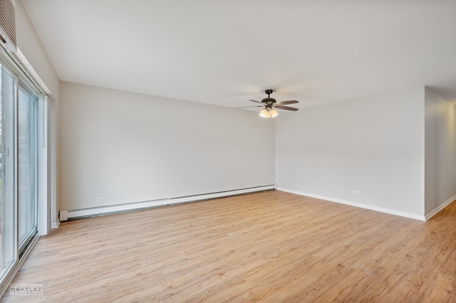 unfurnished room with a baseboard heating unit, baseboards, a ceiling fan, and light wood-type flooring