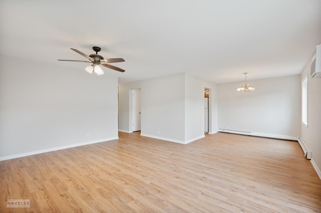 empty room featuring a baseboard radiator, light wood finished floors, baseboards, and ceiling fan with notable chandelier