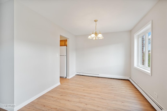 unfurnished dining area featuring a baseboard radiator, light wood-type flooring, baseboards, and an inviting chandelier