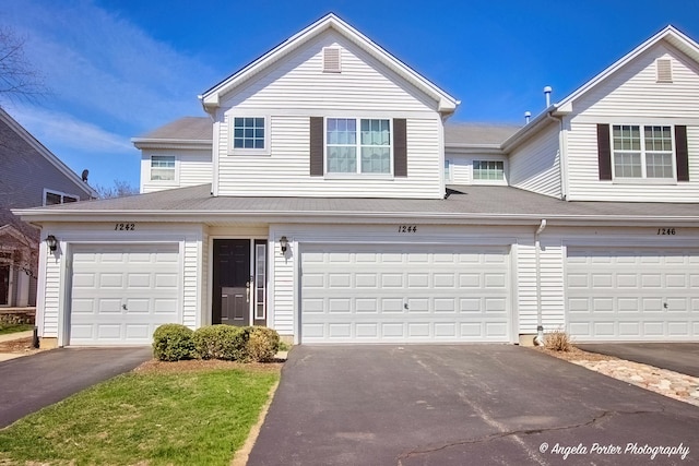 1244 Chesterton Dr Unit 1244, Fox Lake, IL 60020 - townhome / multi-family property featuring an attached garage and aphalt driveway