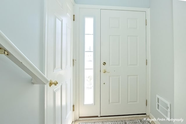1244 Chesterton Dr Unit 1244, Fox Lake, IL 60020 - foyer featuring plenty of natural light, visible vents, and baseboards