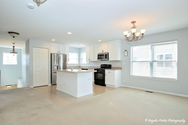 1244 Chesterton Dr Unit 1244, Fox Lake, IL 60020 - kitchen with white cabinets, stainless steel appliances, a notable chandelier, a kitchen island, and hanging light fixtures
