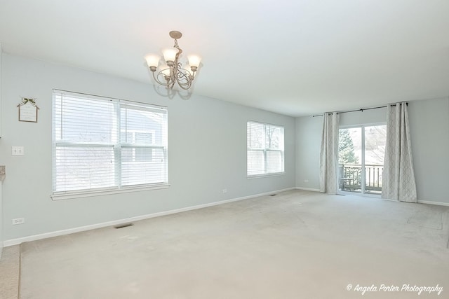 1244 Chesterton Dr Unit 1244, Fox Lake, IL 60020 - spare room with carpet, visible vents, baseboards, and an inviting chandelier