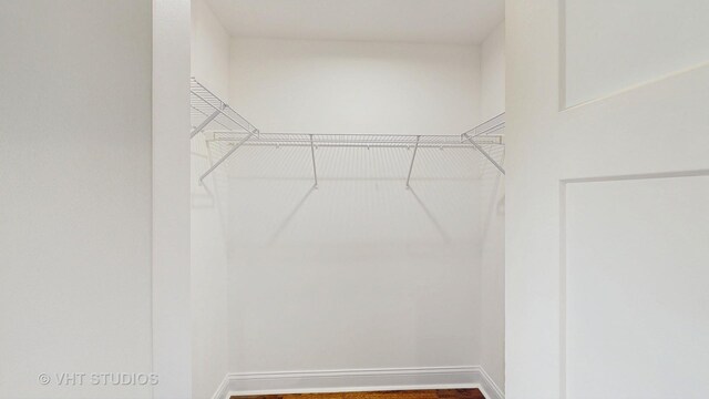 spacious closet with wood finished floors