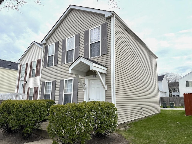 924 Symphony Dr Unit 7036, Aurora, IL 60504 - exterior space featuring cooling unit, a lawn, and fence