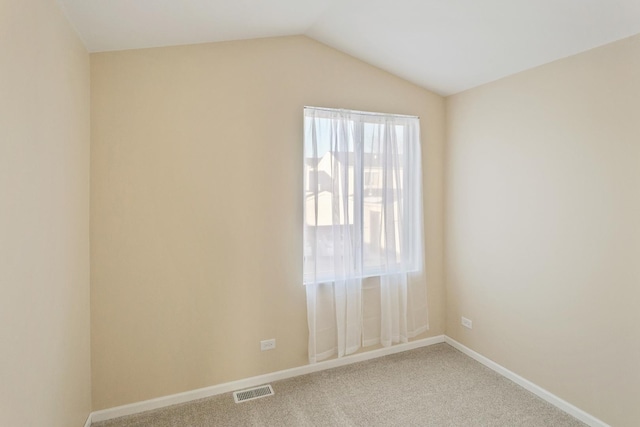 924 Symphony Dr Unit 7036, Aurora, IL 60504 - unfurnished room with lofted ceiling, a healthy amount of sunlight, carpet flooring, and visible vents