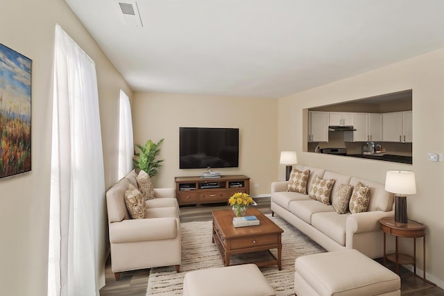924 Symphony Dr Unit 7036, Aurora, IL 60504 - living area with visible vents, baseboards, and wood finished floors