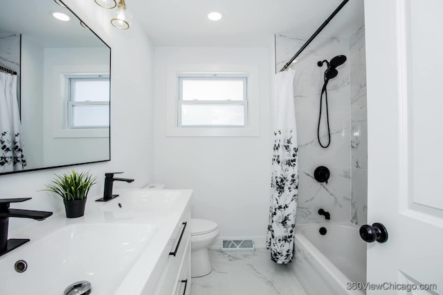 full bath featuring marble finish floor, a sink, visible vents, and plenty of natural light
