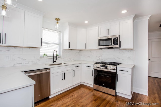 kitchen featuring white cabinets, a sink, and appliances with stainless steel finishes