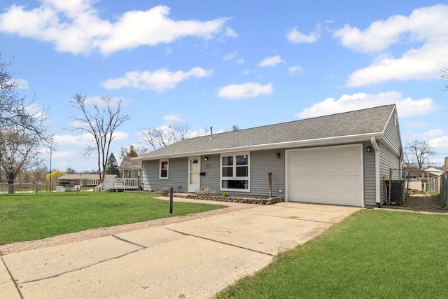 26 S Victoria Ln, Streamwood, IL 60107 - ranch-style house featuring a garage, driveway, a shingled roof, fence, and a front yard