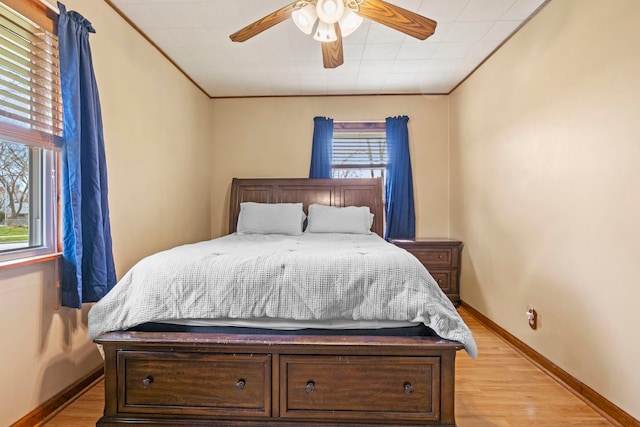 26 S Victoria Ln, Streamwood, IL 60107 - bedroom featuring light wood-type flooring, a ceiling fan, baseboards, and ornamental molding
