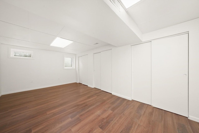 1 Fernwood Ct, Romeoville, IL 60446 - below grade area featuring wood finished floors and baseboards