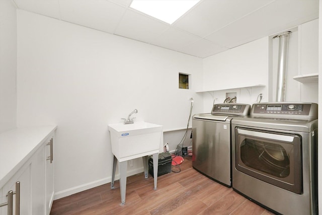 1 Fernwood Ct, Romeoville, IL 60446 - clothes washing area with washing machine and dryer, light wood finished floors, and baseboards