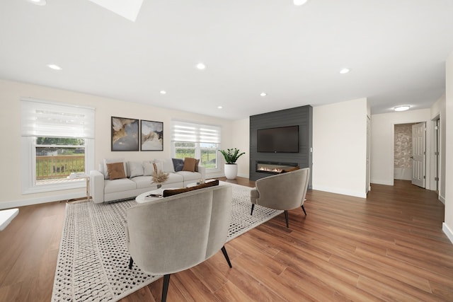 1 Fernwood Ct, Romeoville, IL 60446 - living area featuring baseboards, light wood finished floors, recessed lighting, and a large fireplace