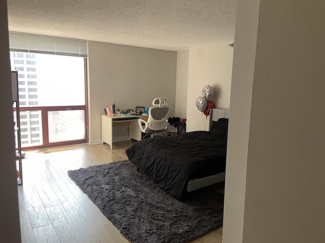 200 N Dearborn St Unit 2406, Chicago, IL 60601 - bedroom featuring wood finished floors and a textured ceiling
