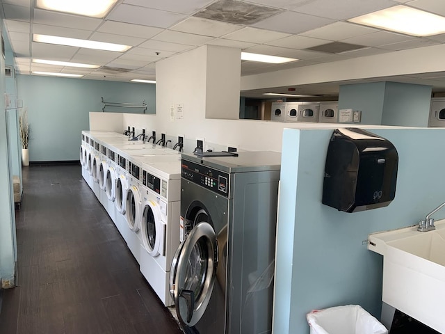 200 N Dearborn St Unit 2406, Chicago, IL 60601 - communal laundry room featuring washer and clothes dryer and dark wood-type flooring