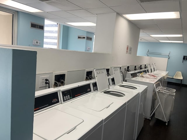 200 N Dearborn St Unit 2406, Chicago, IL 60601 - community laundry with washer and dryer and dark wood finished floors