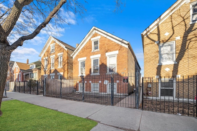 3047 S Millard Ave, Chicago, IL 60623 - view of front of home with a gate, brick siding, and a fenced front yard