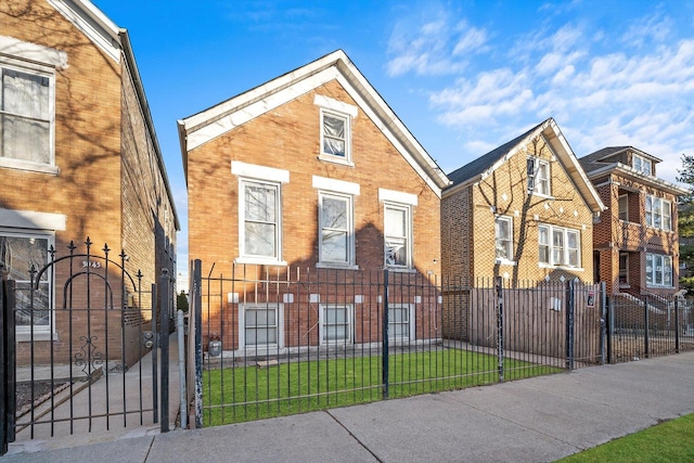 3047 S Millard Ave, Chicago, IL 60623 - view of front facade featuring a gate, a fenced front yard, brick siding, and a front yard