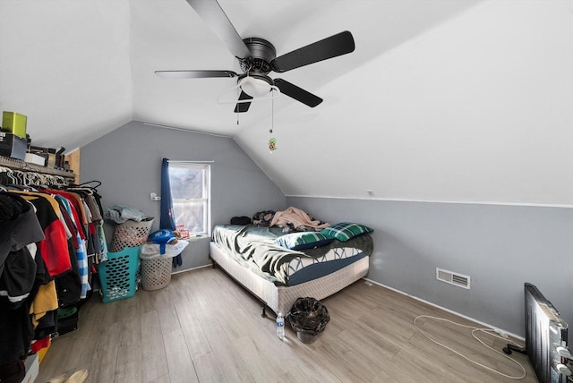 3047 S Millard Ave, Chicago, IL 60623 - bedroom with wood finished floors, visible vents, vaulted ceiling, and ceiling fan