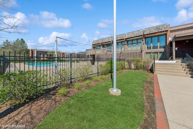 3085 Pheasant Creek Dr Unit 110, Northbrook, IL 60062 - view of yard featuring a community pool and fence