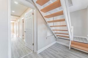 3507 N Osceola Ave, Chicago, IL 60634 - additional living space featuring wood finished floors and stairway