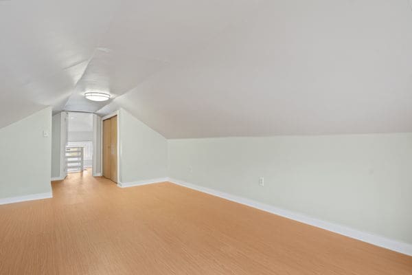 3507 N Osceola Ave, Chicago, IL 60634 - additional living space featuring lofted ceiling and light wood-style floors