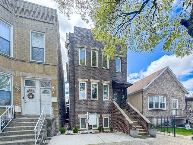 455 W 38th St, Chicago, IL 60609 - view of front of home with brick siding and fence