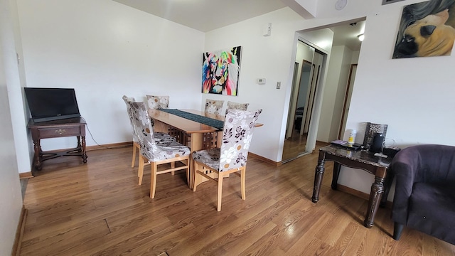 6084 Fremont Dr Unit 6084, Hanover Park, IL 60133 - dining space featuring baseboards and wood finished floors