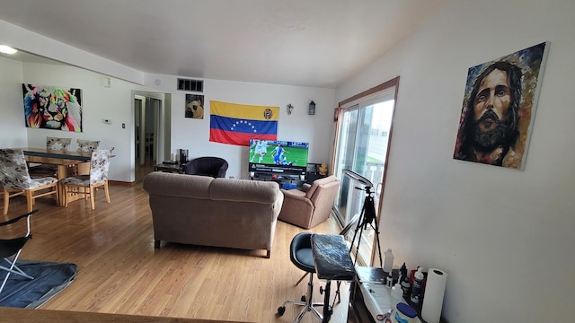 6084 Fremont Dr Unit 6084, Hanover Park, IL 60133 - living room featuring light wood-style floors and visible vents