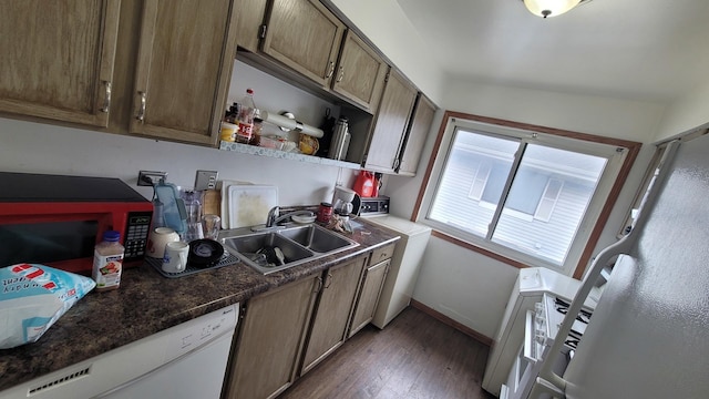 6084 Fremont Dr Unit 6084, Hanover Park, IL 60133 - kitchen featuring washer / clothes dryer, baseboards, dark wood-style floors, white dishwasher, and a sink