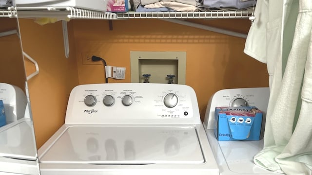 clothes washing area featuring washing machine and clothes dryer