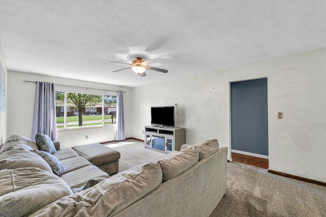 2240 Marilyn Dr, Saint Joseph, IL 61873 - living room featuring carpet, a ceiling fan, baseboards, and a textured ceiling