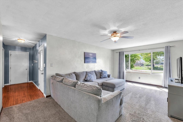 2240 Marilyn Dr, Saint Joseph, IL 61873 - living area with carpet, a ceiling fan, a textured ceiling, and baseboards
