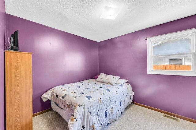 2240 Marilyn Dr, Saint Joseph, IL 61873 - bedroom with a textured ceiling, carpet floors, and baseboards