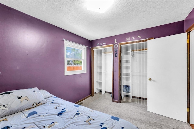 2240 Marilyn Dr, Saint Joseph, IL 61873 - carpeted bedroom with a textured ceiling and baseboards