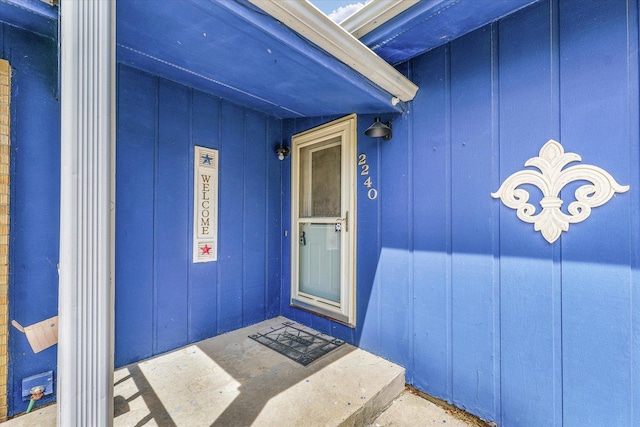 2240 Marilyn Dr, Saint Joseph, IL 61873 - doorway to property featuring board and batten siding