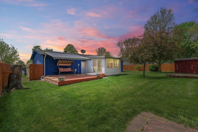 2240 Marilyn Dr, Saint Joseph, IL 61873 - rear view of house with a wooden deck and a sunroom