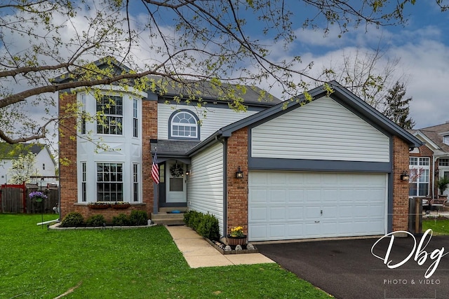 traditional-style home with a garage, fence, aphalt driveway, and brick siding