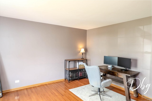 office area featuring baseboards and wood finished floors
