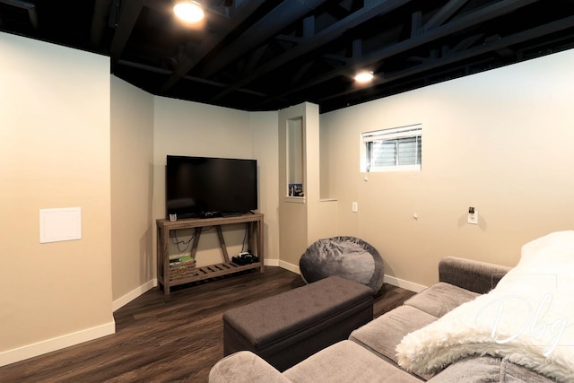 home theater room featuring baseboards and dark wood-style flooring