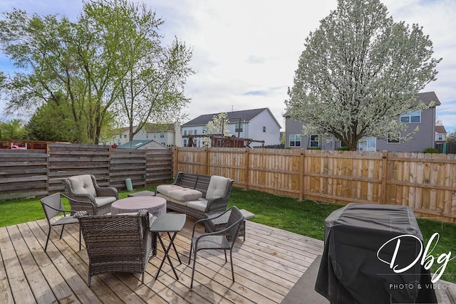 wooden terrace with a fenced backyard, outdoor lounge area, and a residential view