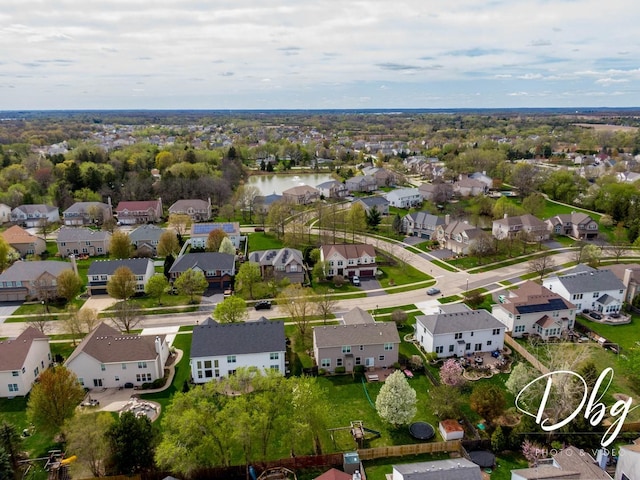 drone / aerial view with a residential view and a water view