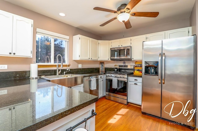 kitchen with ceiling fan, light wood-style floors, stainless steel appliances, recessed lighting, and white cabinetry