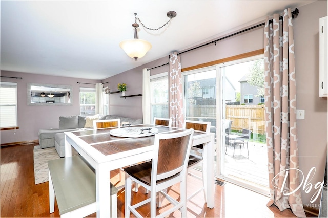 dining area featuring baseboards and wood finished floors