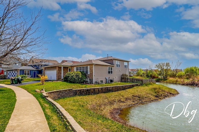 2272 Iroquois Ln, Round Lake Heights, IL 60073 - view of side of home featuring fence, driveway, cooling unit, an attached garage, and a yard