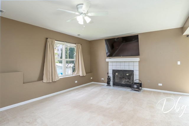 2272 Iroquois Ln, Round Lake Heights, IL 60073 - unfurnished living room with visible vents, baseboards, ceiling fan, a tile fireplace, and carpet flooring